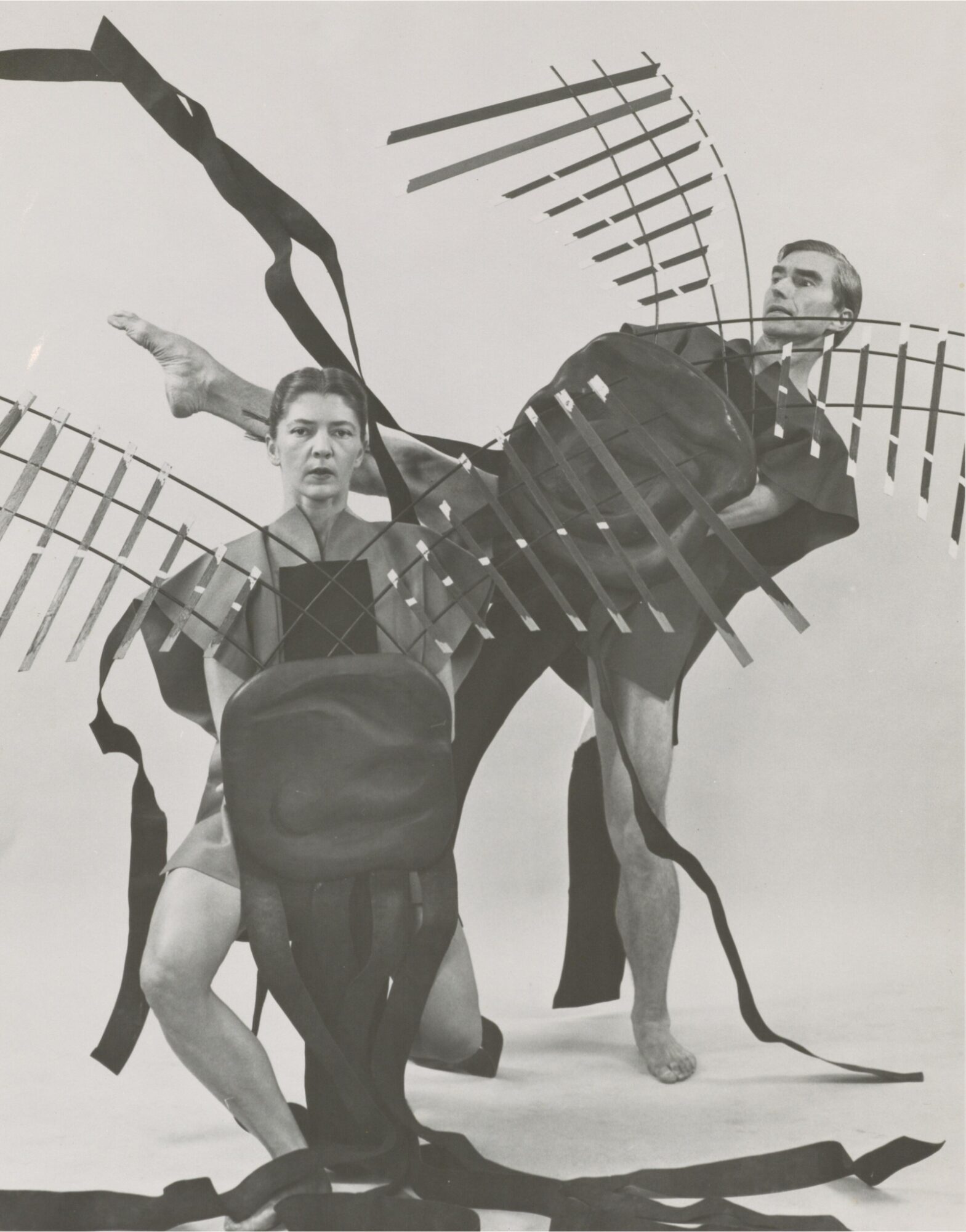 Nancy Lang and Erick Hawkins in Here and Now with Watchers, with hand-held stage designs by Ralph Dorazio. Photograph by Radford Bascom, 1957. From the Erick Hawkins and Lucia Dlugoszewski Papers, Mus